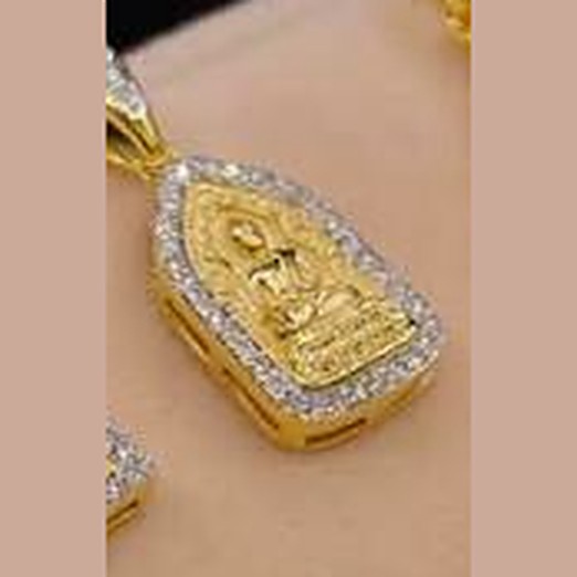 Gold amulet frame with a seated Buddha, framed in white stones