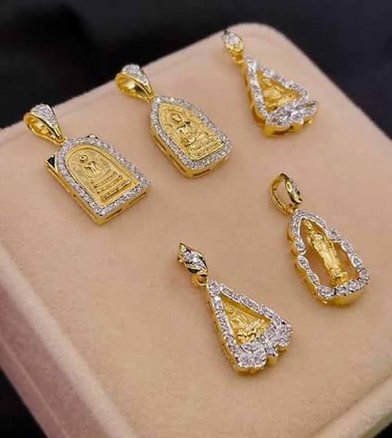 Gold Buddha amulet frames set with white stones